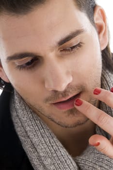 lips of man being touched by female hands with white background