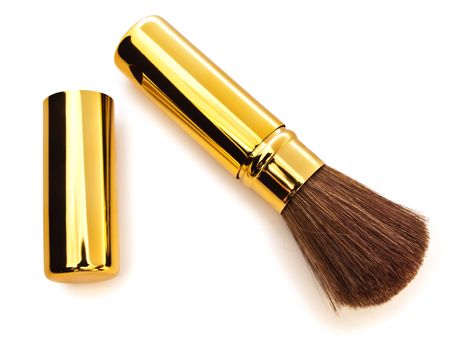 Portable make-up brush over the white background