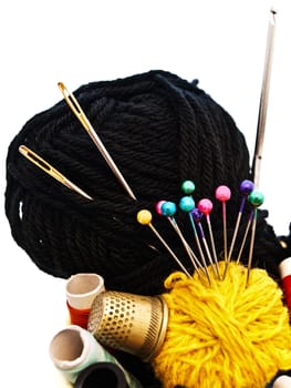 different knitting items over the white background