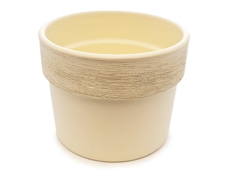 empty beige flowerpot over the black background