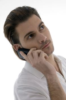 young man talking on the cellphone on an isolated white backgound