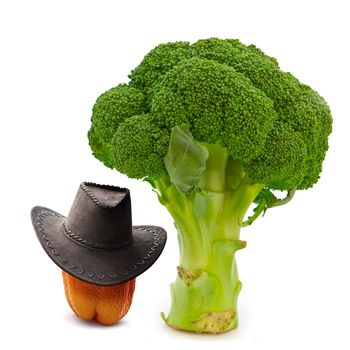 paprika in cowboy hat near green broccoli over white background 
