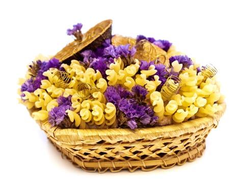  yellow pasta and flowers in the basket 