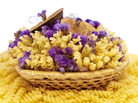  yellow pasta and flowers in the basket 