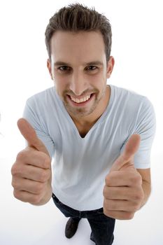 young man showing thumbs up gesture on an isolated white backgound