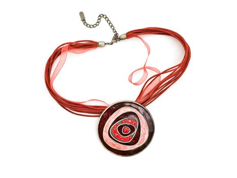 fashion necklace with bright red gems over white  background