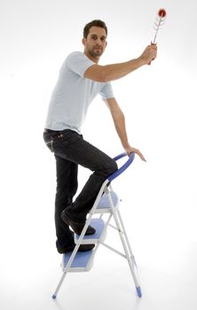 young man painting on an isolated white backgound