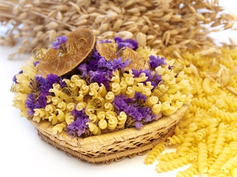  yellow pasta and flowers in the basket 