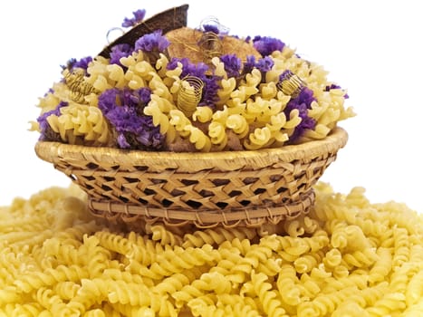  yellow pasta and flowers in the basket 