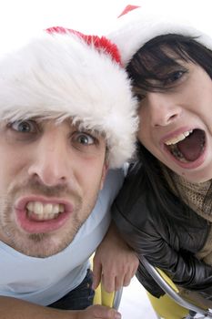 young couple with chritsmas hat on an isolated white backgound