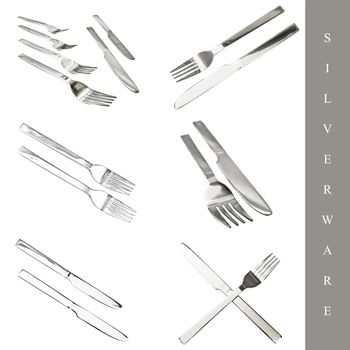 Set of kitchen silverware: knife and fork over white bckground
