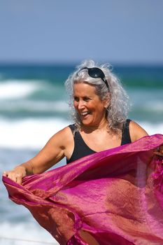 an older female having fun at the beach