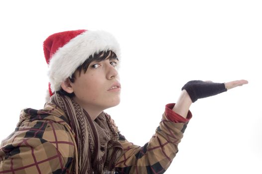 young boy wearing christmas hat showing palm on an isolated background