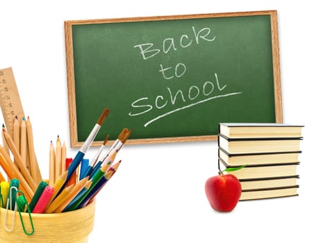 "Back to school!"  theme with red apple, stack of books and stationery against green blackboard