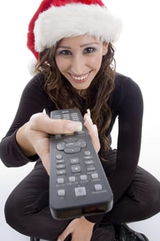 smiling woman with remote control against white background