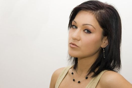portrait of young charming brunette, over white