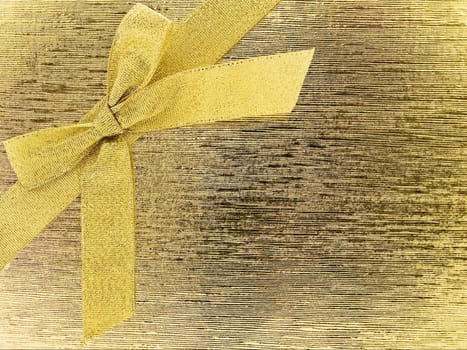 golden bow over the abstract gold background