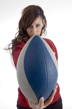 woman holding football on an isolated white background