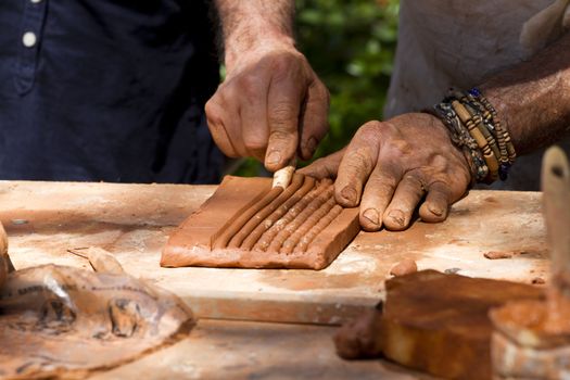 Men at work, clay craftsman
