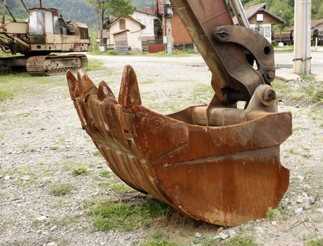 A really old excavator gear abandoned in a valley