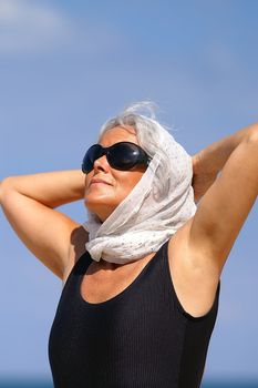 elder woman at the beach
