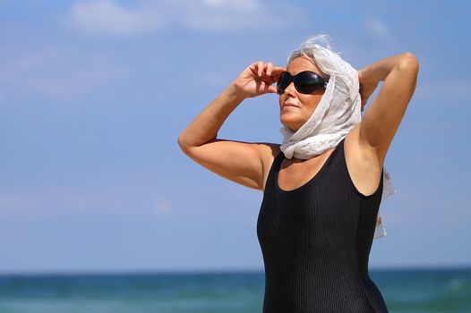 an elder woman at the beach