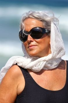 an elder woman at the beach