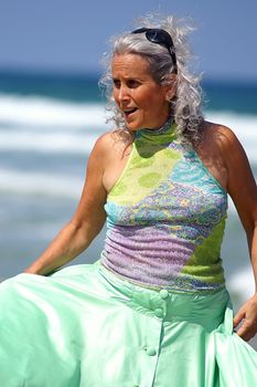 an elder woman at the beach