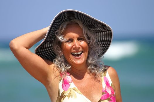 happy elder woman at the beach