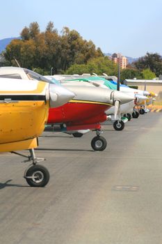 Close up of a row of airplanes.
