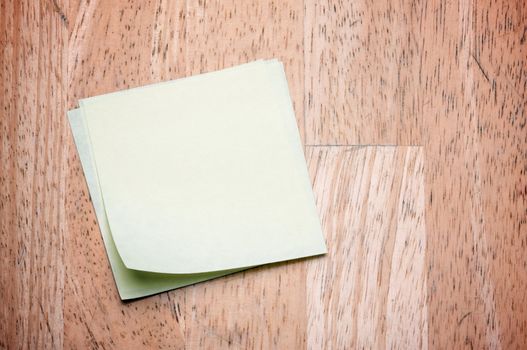 Post It Notes on Wood Background
