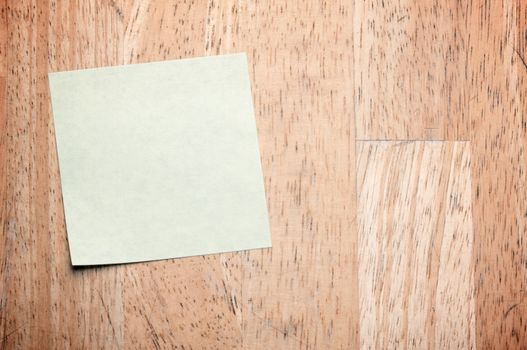 Post It Note on Wood Background