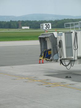 empty airplane gate with small trucksempty airplane gate with small trucksempty airplane gate with small trucksempty airplane gate with small trucksempty airplane gate with small trucks