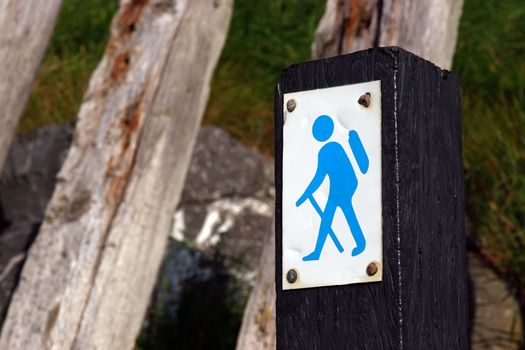 a direction sign for a designated tourist walk