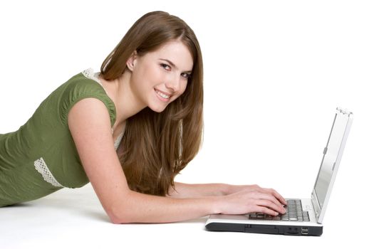 Isolated teen girl using laptop computer