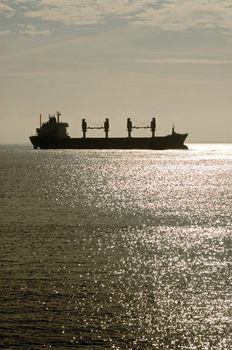 ship cruising on North Sea by sundown light