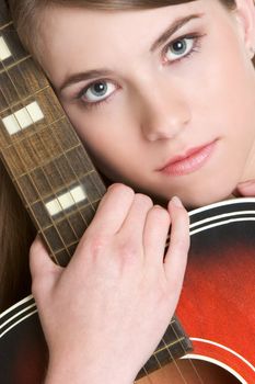 Pretty girl holding acoustic guitar