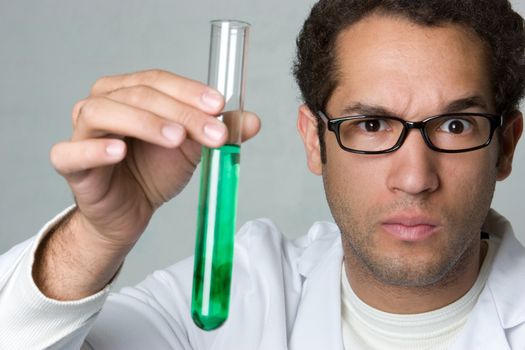 Scientist man holding test tube