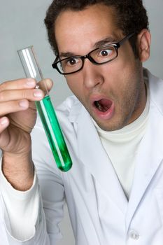 Shocked man holding test tube