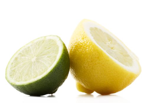 one half lemon and half lime on white background