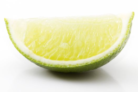 on piece of lime on white background