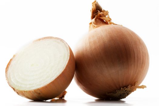 one onion and a half onion on white background