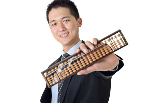 Young Asian businessman holding Chinese traditional calculator with smile on white background.