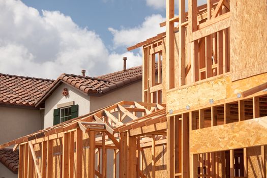 Abstract of New Home Construction Framing And Completed House.