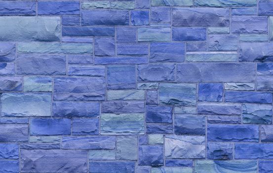 Seamless blue masonry wall with irregular size rectangular stones. The texture repeats seamlessly both vertically and horizontally.