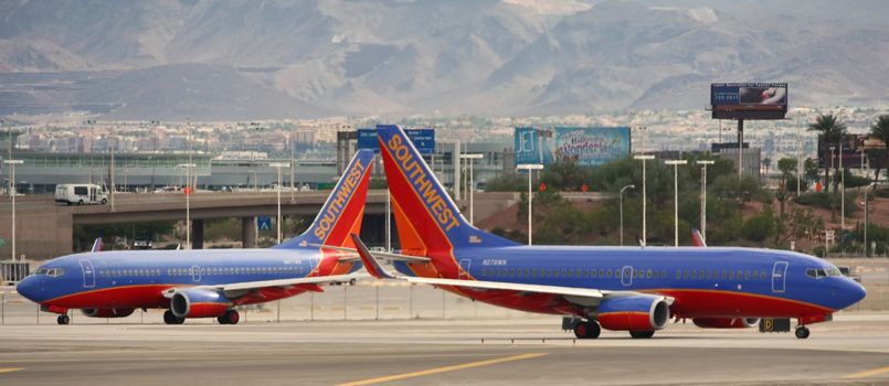 LAS VEGAS - OCT 31: Taken in Las Vegas, Nevada at McCarran Airport on Friday, October, 31, 2008. Two Southwest Airlines pass each other on the tarmac before take off.