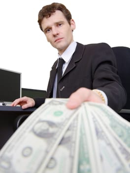 The man in a business suit stretches dollars on the white background