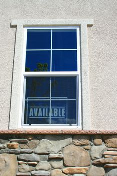 Close up of available sign in a new house.
