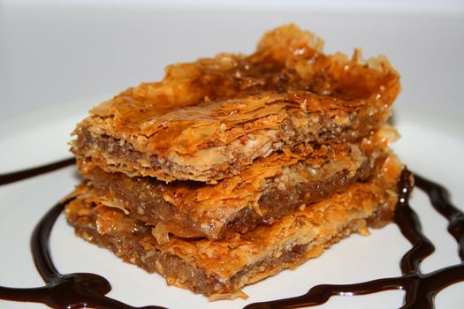 Close up of a baklava on a plate.
