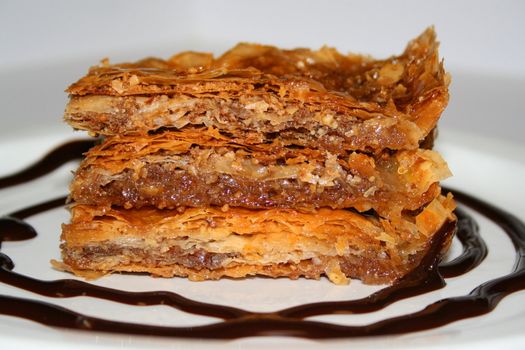 Close up of a baklava on a plate.
